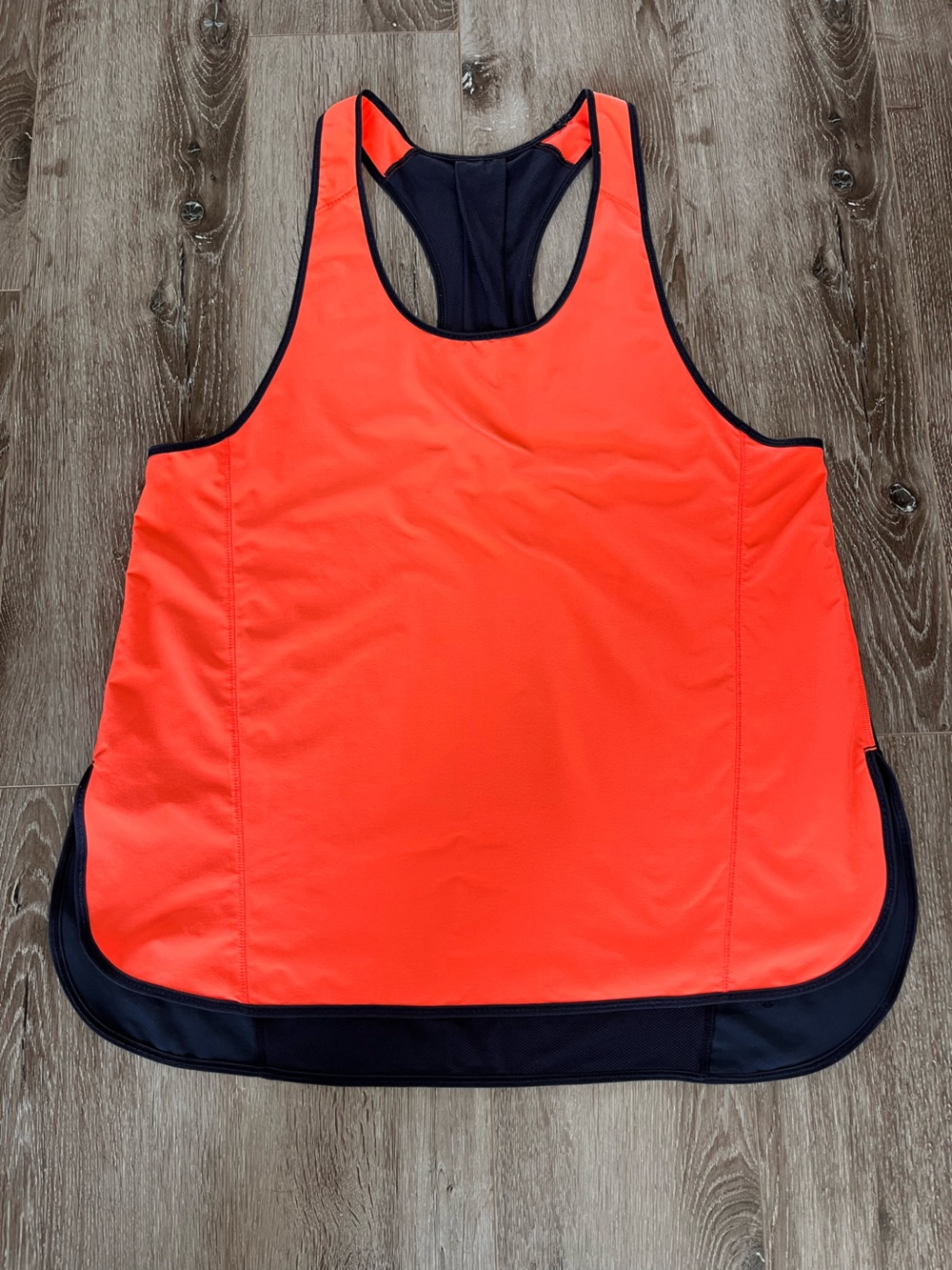 Lululemon Women's Pump it up tank top.
Light weight Racerback. Orange and Navy